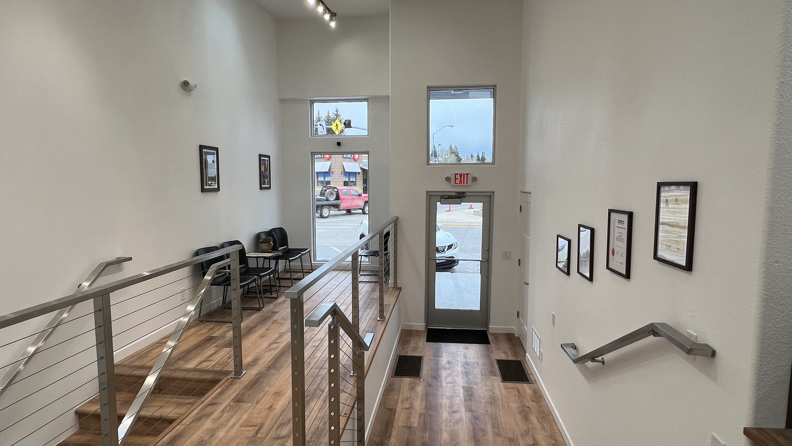 The entrance and reception area of 821 South Main, with tall ceilings and windows looking out onto Main Street in downtown Kemmerer